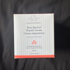 Drunk Elephant Bora Barrier Repair Cream in White and Red